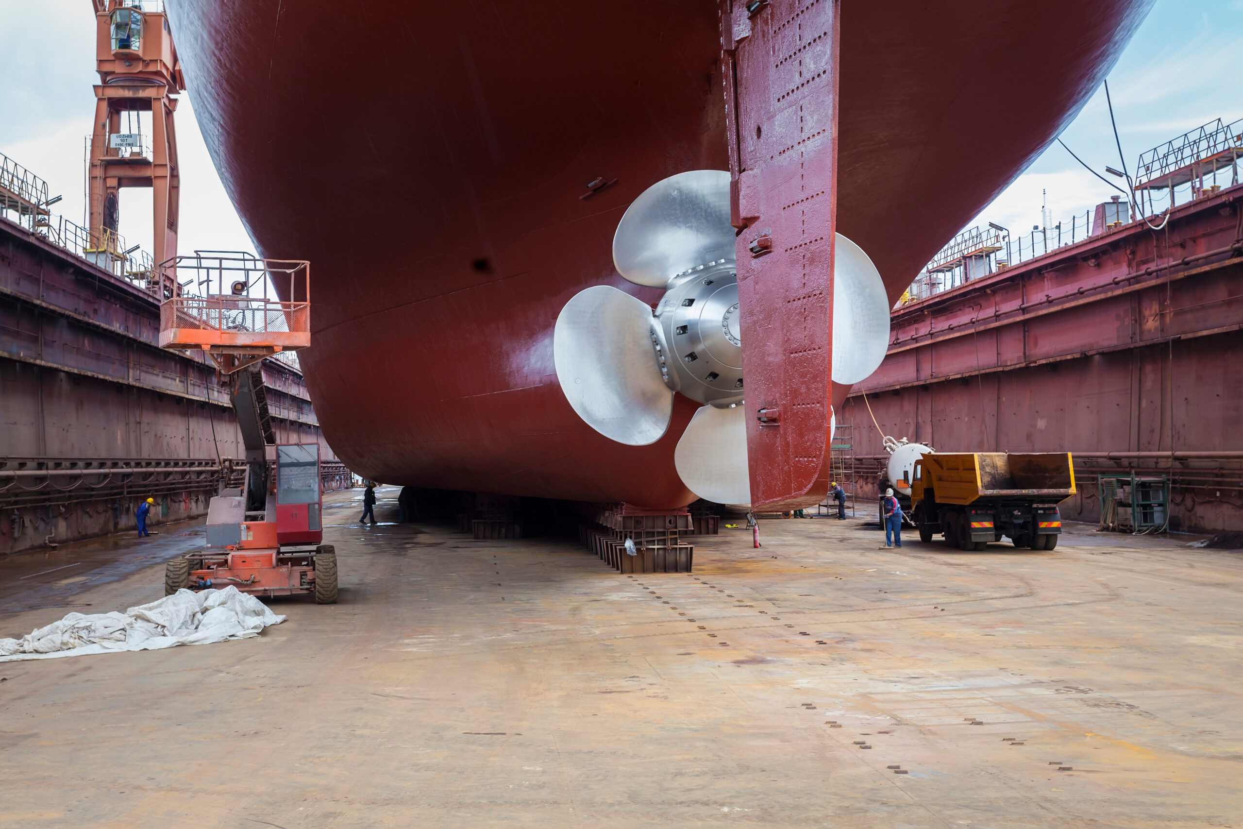 Worker inspecting bolts